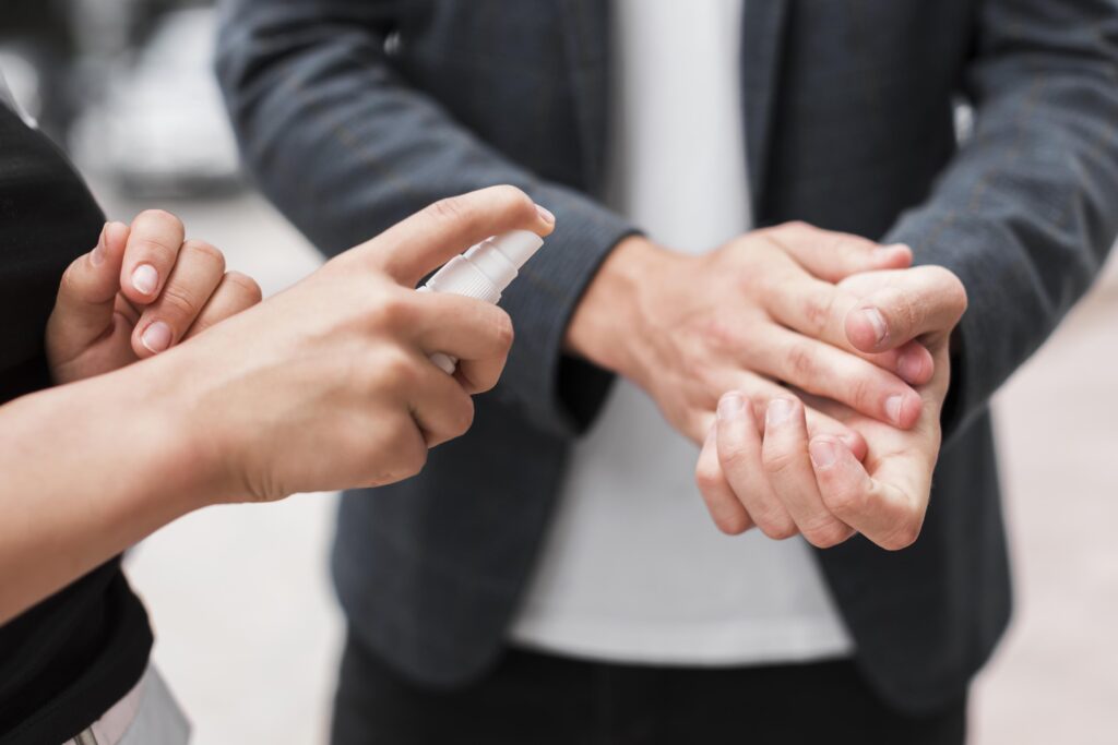 using hand sanitizer in the office